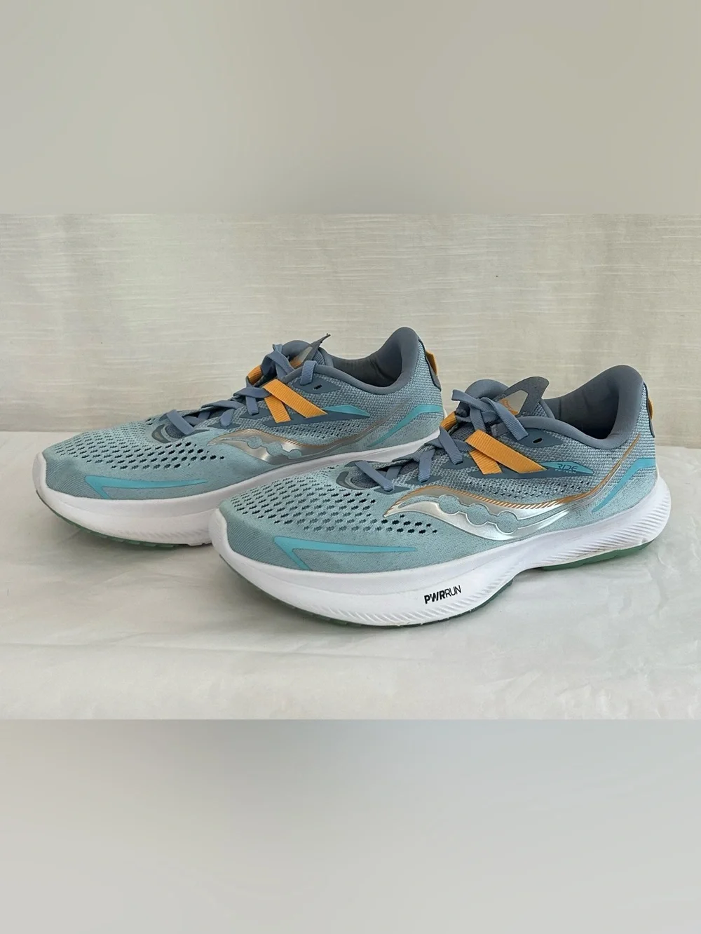 Saucony Ride 15 Women's Light Blue Athletic Sneakers with Yellow Accents